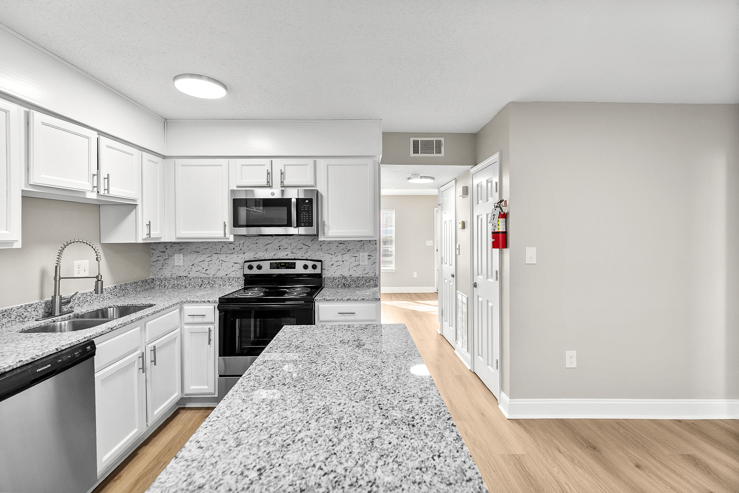 Bright modern kitchen with white cabinets and island